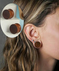Woman wearing 16mm wood ear plugs, showing Three Pairs Organic Wood Ear Plugs Set With Double Flared Ear Tunnels Saddle Fit Wooden Gauges