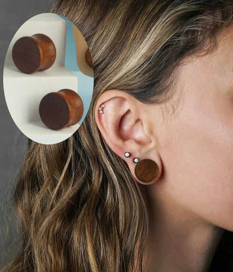 Woman wearing 16mm wood ear plugs, showing Three Pairs Organic Wood Ear Plugs Set With Double Flared Ear Tunnels Saddle Fit Wooden Gauges