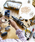 Person using rotary tool with 120 Piece Wool Polishing Tools Set With Shank Wool Felt Buffing Wheels For Rotary And Drill Polisher Pro Grade Polishing Wheel Kit For Metal Wood And Automotive Finishing on wooden table.