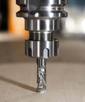 Front view: SpeTool spiral compression router bit, solid carbide 1/2 in shank, 1/2 in diameter mounted in spindle