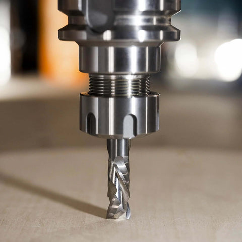 Front view: SpeTool spiral compression router bit, solid carbide 1/2 in shank, 1/2 in diameter mounted in spindle