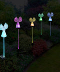 Two Pack Outdoor Solar Garden Lights With Color Changing LEDs, IP67 Waterproof Angel Decor Stakes glowing at night in garden