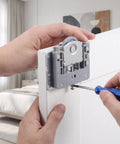 Installing smooth sliding closet door rollers with built in damping for wooden wardrobe panels.