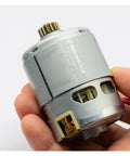 Heavy Duty Electric Starter Motor Assembly With 15 Tooth Pinion Gear, RZ-735VA-9517 in hand, for 12 Volt 14 Volt 18 Volt tools.