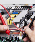 Top Shelf Heat Shrink Label Tape Compatible With Hse221 Refill Roll used on wires in electrical testing with multimeter.