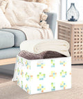 Stackable Storage Bins With Lids, 16.5 By 12.6 By 11.8 Inch Foldable Closet Organizers holding rolled blankets in a living room.