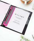 3 Hole Punch For Ring Binders With Built In Ruler, Handy Portable Paper Puncher in deep pink, shown in a binder with paper.