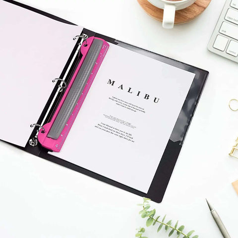 3 Hole Punch For Ring Binders With Built In Ruler, Handy Portable Paper Puncher in deep pink, shown in a binder with paper.