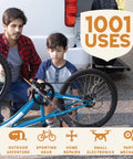 Man and boy fixing a blue bicycle using Multipurpose Plant Based Lubricant Spray Pack Of 3 All In One For Rust Removal And Lubricating Garage Doors Hinges And Locks, Eco Friendly Formula No Petroleum No PTFE 11 Oz Each Great For Tools And Equipment, 1001 uses listed.