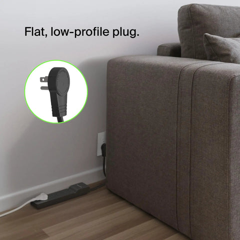 Six Outlet Surge Protector Power Strip With Six Foot Long Heavy Duty Extension Cord 360 Degree Rotating Plug And 600 Joules shown behind a sofa