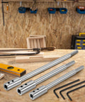 Heavy Duty Forstner Bit Extension For 3/8 Inch Round Shank on wooden workbench, showing three carbon steel extenders.