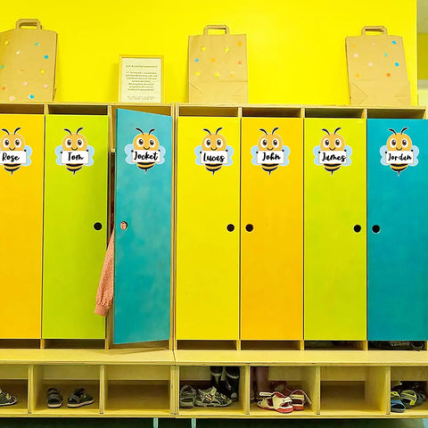 Colorful cubbies with Bee Cutouts For Classroom Decorations 50 Pack Name Tags And Desk Nameplates on doors.