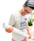 Man holding a rolled Colorful Wall Map Poster With Flags And Capitals, The Ultimate World Map For Classrooms And Homes.