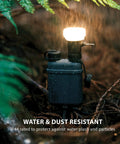 Go-To Rugged Outdoor Camping LED Lantern With Mini Tripod in rain showing IP44 weatherproof feature.