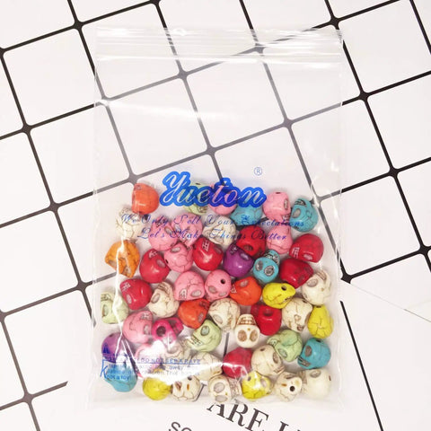 Pack Of 50 Mixed Color Turquoise Skull Head Spacer Beads For DIY Jewelry Making And Crafting in a clear bag, assorted colors