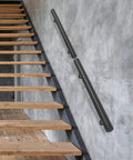 Wall Mounted Stainless Steel Handrail For Indoor Stairs Showing Off A Matte Coat And Tank Grade Build That Takes Scratches Like A Boss While Keeping Your Steps Locked Down Tight, installed alongside wooden stairs.
