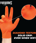 Close-up of orange nitrile glove showcasing raised diamond grip texture, marketed as Orange Nitrile 8 Mil Heavy Duty Gloves with Raised Diamond Grip For Mechanics XL.