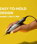 Side view of a Dremel Stylo+ engraving pen held in a hand; gray-silver body with blue button