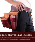 Pro 3 Pouch Tool Bag With Double Outer Pockets And 10 Tool Holders on a person’s waist, showcasing leather material and pockets.