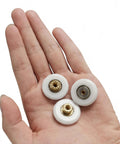 Three 19mm Shower Door Rollers Replacement Set 6 Pieces For Sliding Doors held in palm, 304 stainless steel screws, copper core