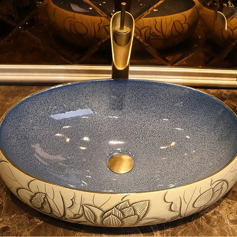 Bathroom Sinks Bathroom Vessel Sink Carved Lotus Art Countertop Basin with smooth blue and floral ceramic design.