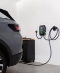 Level 2 Wall Mounted EV Charger With 40 Amp Fast Charging And 25 Foot Flexible Cable NEMA 14 50 Plug installed in garage beside vehicle.