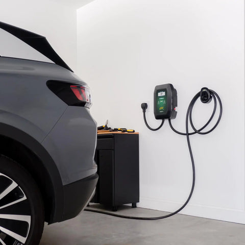 Level 2 Wall Mounted EV Charger With 40 Amp Fast Charging And 25 Foot Flexible Cable NEMA 14 50 Plug installed in garage beside vehicle.