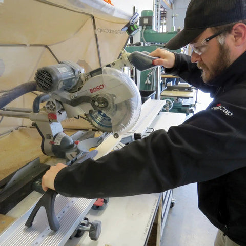 Man using 10 Million Dollar Stick For Safe Small Part Cutting With Wishbone Grip And Rubber Feet Injection Molded Standalone Holder