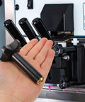 Plastic Ice Cream Maker Nut Fastener Replacement Part in hand near a portable machine, universal fit