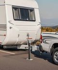 Front view: trailer tongue jack mounted to RV hitch, bolt-on, with crank handle and ground base