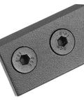 Close-up of a black metal flat fixing plate with screws, part of Barn Door Hardware Kit With Track Connector And Heavy Duty Metal Splicing For Smooth Sliding Doors Flat Fixing Plate And Straight Bracket Design For Built To Last Easy Install And Quiet Operation.