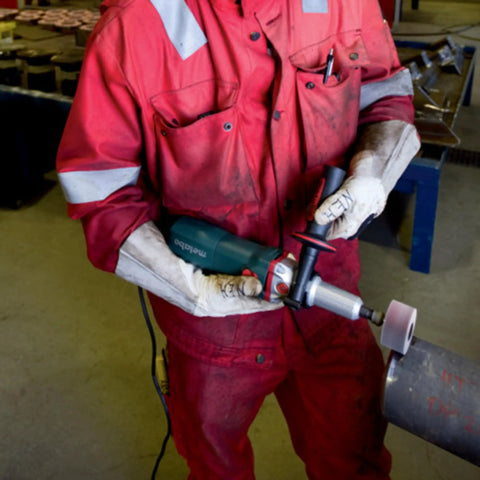 Heavy Duty Variable Speed Die Grinder With Badass High Torque Planetary Gears And Easy Swap Spindle Lock For Rock Solid Metalworking and Finishing Jobs Featuring Smooth Nine Hundred Fifty Watt Motor in use on metal pipe.