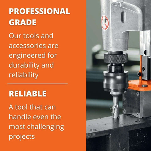 Side view of industrial drill press with cutting tool in chuck and orange housing