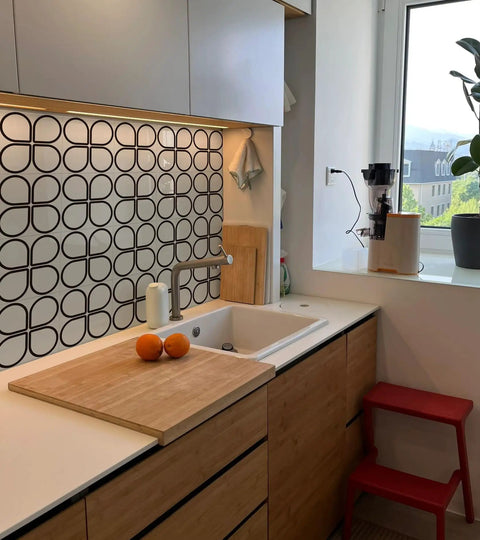 Modern kitchen with Cream Glossy White Peel And Stick Backsplash Tiles With Floral Design above wooden countertop and sink