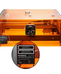 40W Laser Engraver With Acrylic Enclosure Air Assist Pump Honeycomb Bed Built In Camera And Safety Class 1 All In One Laser Engraving Machine Delivers Crazy Fast 40000 Millimeters Per Minute Speed For Wood Plastic Leather Metal Projects, front view with close-up of model details