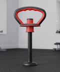Red Dope Adjustable Kettlebell Handle Grip For Dumbbells With Stable Plastic Base in a gym setting, ergonomic design visible