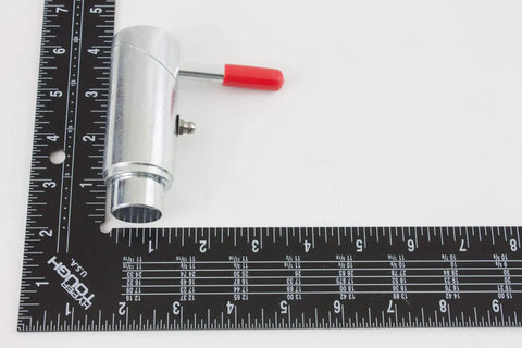 Close-up of Heavy Duty 1 Inch Spring Loaded Cam Lock Plunger Pin With Grease Fitting Zinc Plated Steel against a ruler.