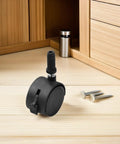 4pcs Swivel Caster Wheels Black for Furniture and Displays Inch, single wheel on wooden surface with screws nearby.
