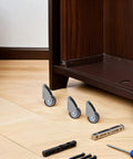 Fixed Caster Wheels Inch 6pcs Rubber for Furniture and Carts on wooden floor next to a cabinet, showcasing their design.