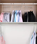 Space Saving Cloth Hangers Set of 12, Heavy Duty Metal Closet Organizer With Magic Hanger System in use with shirts and coats