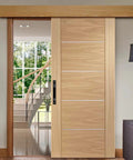 2 Pack Sliding Barn Door Handle 7.9 Inch Aluminum Alloy Door Pull For Sliding Barn Gate Cabinet Closet Drawer Garage Shed Black Finish on wooden sliding door installed inside home with visible staircase and greenery outside window.