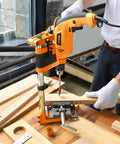 Adjustable Universal Drill Press Stand With Heavy Duty Aluminum Base For Precision Woodworking in use, drilling wood with stability.