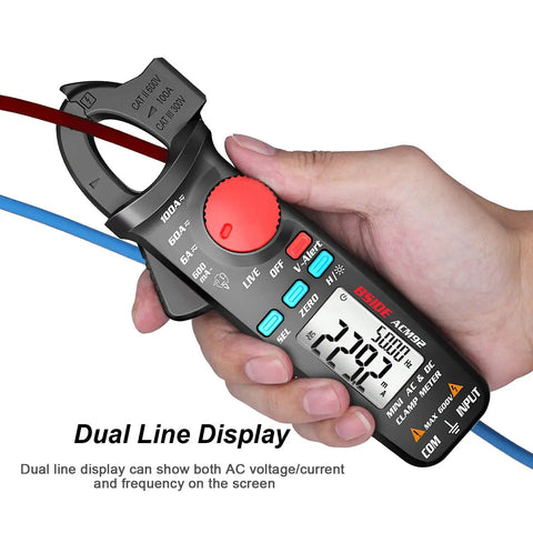 Hand holding DC Current Clamp Meter 6000 Counts Digital Multimeter Amp Continuity Ohm Hz Live Check V Alert Voltage Tester