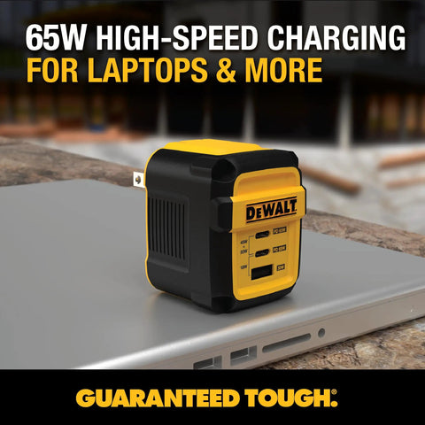 GaN 65W Three Port USB C Charger Block With PPS Fast Charge on top of a laptop, featuring a compact yellow foldable design.