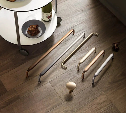 Variety of cabinet pulls on wood floor, featuring six pack 10 inch hole center cabinet pulls light brushed brass zinc alloy kitchen drawer handles 10.45 inch length with included M4 screws for easy install.