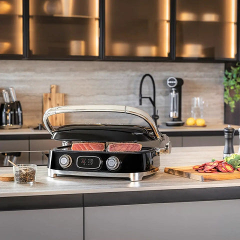 SMEG MGF01 Retro Countertop Electric Grill and Panini Press With Swappable Plates For Waffles, Burgers, And Steak in stylish kitchen setting.