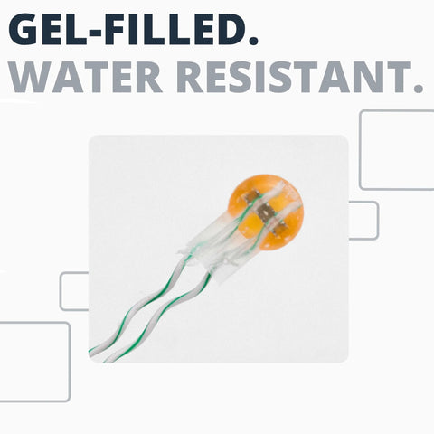 Gel-filled wire splice connector, orange circular gel seal with green and white insulated wires