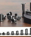 Premium 110 Set Chicago Screws And Leather Rivets Assorted Binding Fasteners For DIY Leather Craft Belts Bags And Shoe Repair Dang Tough Boss Quality Carbon Steel hardware pieces on a wooden surface.