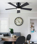 Sleek 46 Inch Flush Mount Ceiling Fan With Integrated Light Kit And Wireless Remote, Five Reversible Matte Black Blades in cozy dining area.