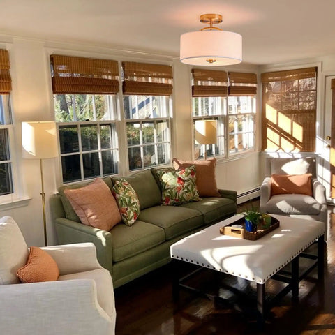 Living room with 13 Inch Mid Century Modern Flush Mount Ceiling Light With Cream White Fabric Shade And Antique Brass Finish 3 Light Drum Fixture
